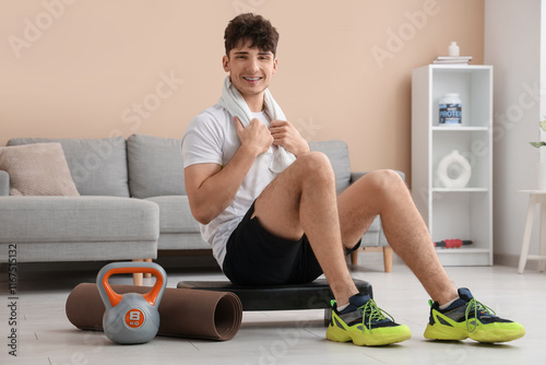 Young man with towel and br...