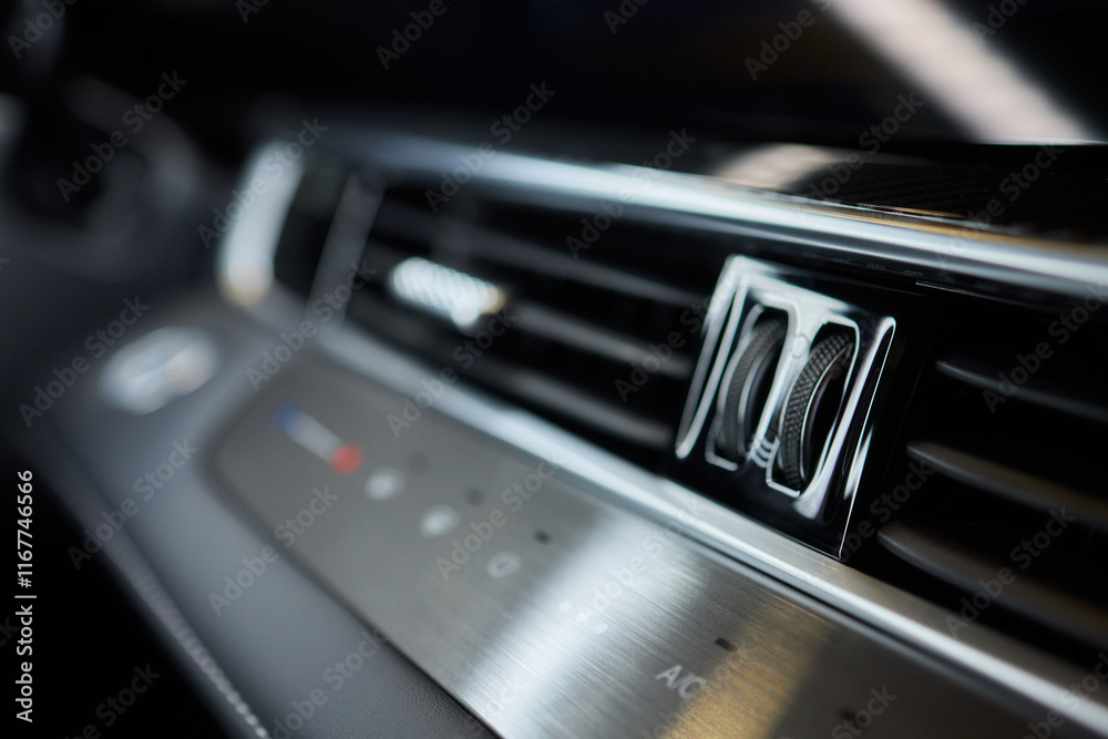 Closeup of car dashboard air vents near gear shift Closeup of car dashboard air vents near gear shift