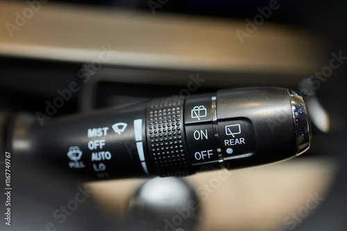 A detailed closeup view of the interior of a car, showcasing various controls and features photo