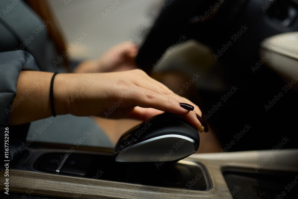 An Elegant Hand Gracefully Resting on the Luxury Car Gear Shift of a Modern Vehicle An Elegant Hand Gracefully Resting on the Luxury Car Gear Shift of a Modern Vehicle