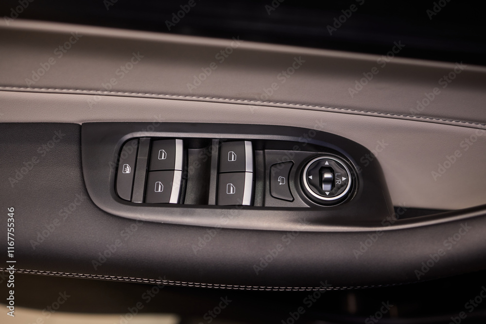 Naklejka premium Modern Car Door Control Panel with Window Switches for convenience and functionality