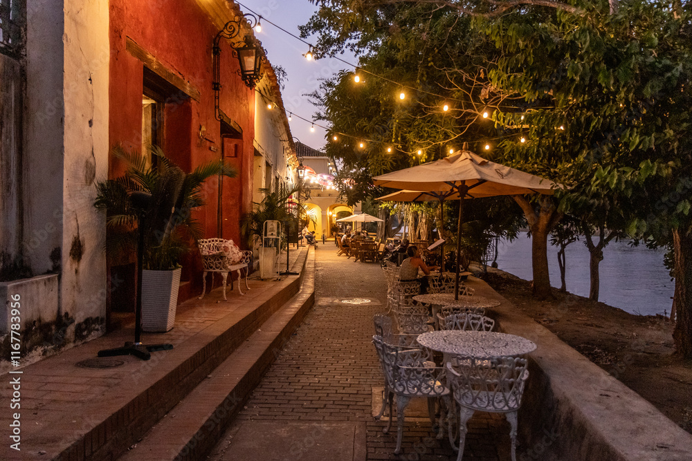 Fototapeta premium Night view of riverside restaurants in Santa Cruz de Mompox, Colombia