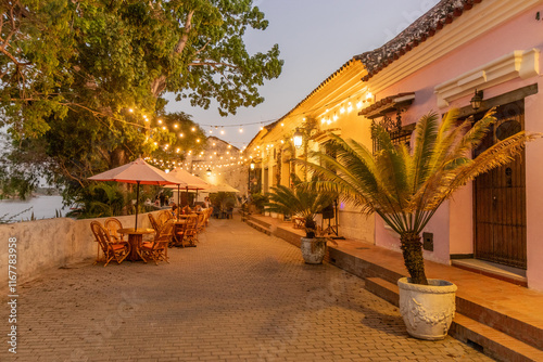Night view of riverside restaurants in Santa Cruz de Mompox, Colombia photo