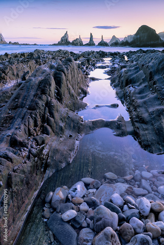 Dawn between sea and rocks. Taking advantage of the low tide of the new moon, we can approach some rocks that are not easy to photograph up close.