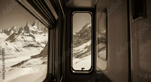 A scenic train ride through a snowy mountain landscape with large panoramic windows