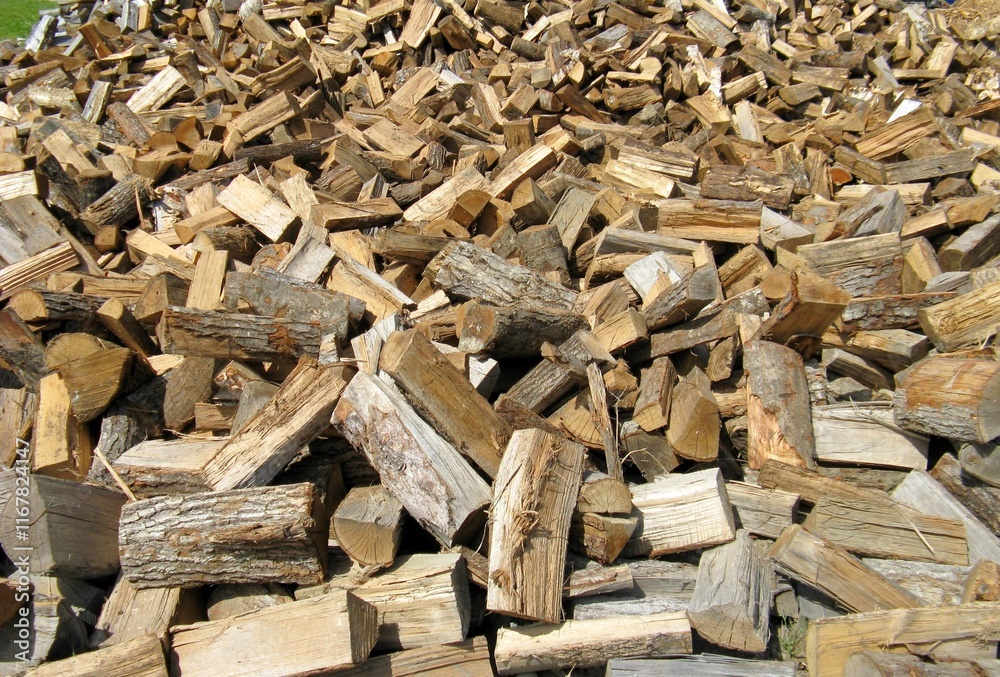a large outdoor woodpile shows preparation for the winter freezing cold a large outdoor woodpile shows preparation for the winter freezing cold