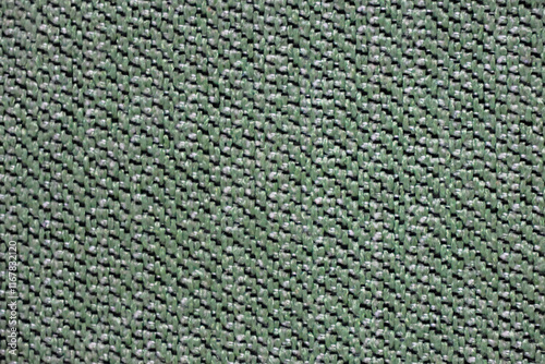 Green tweed texture closeup as background. Background for designers.