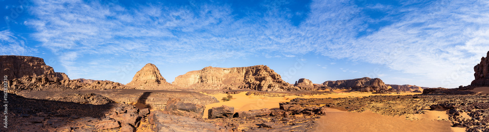 Tadrart Rouge, meaning Red Mountain, a mountain range in southeastern Algeria, part of the Algerian Desert providing massive dunes, rock formations and Martian landscapes Tadrart Rouge, meaning Red Mountain, a mountain range in southeastern Algeria, part of the Algerian Desert providing massive dunes, rock formations and Martian landscapes