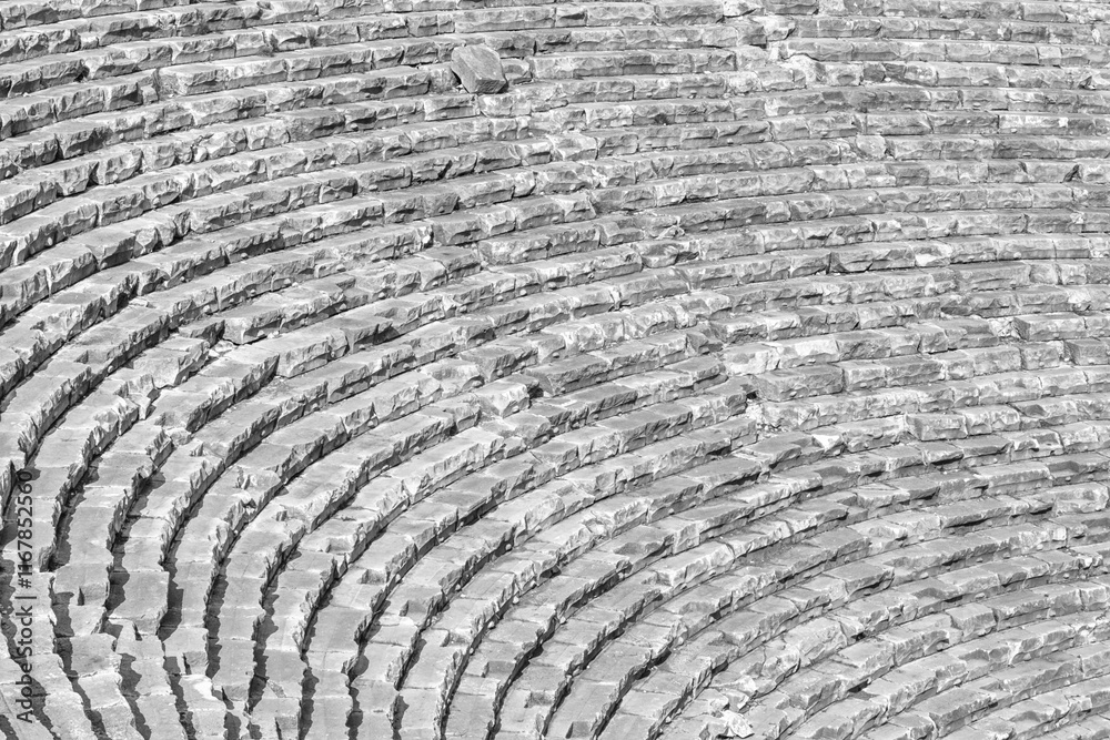 Mediterranean cityscape, in black-and-white color - view of the spectator seats in the theater of the ancient city of Myra, near the Turkish town of Demre, Antalya Province in Turkey Mediterranean cityscape, in black-and-white color - view of the spectator seats in the theater of the ancient city of Myra, near the Turkish town of Demre, Antalya Province in Turkey