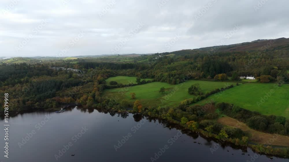 Lough Eske in Donegal Ireland - A tranquil view of a lake reflecting the cloudy sky at dusk, showcasing natures peacefulness and serenity Lough Eske in Donegal Ireland - A tranquil view of a lake reflecting the cloudy sky at dusk, showcasing natures peacefulness and serenity