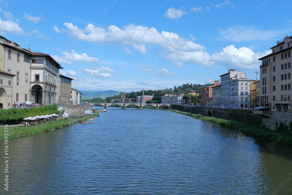 Fototapeta premium The Daily Life of the Arno River in Florence, Romantic Italy