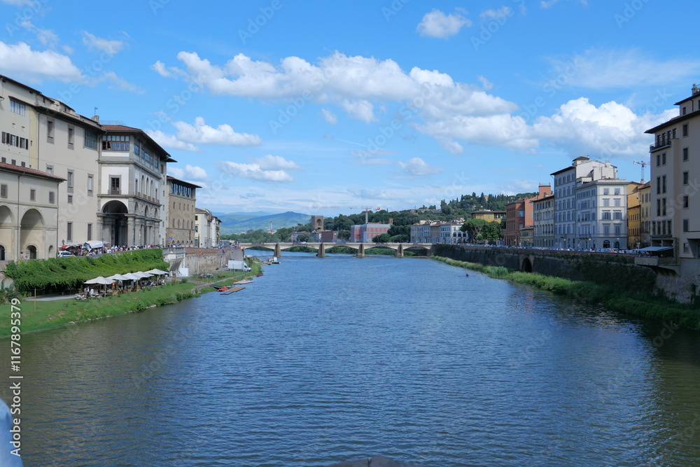 Fototapeta premium The Daily Life of the Arno River in Florence, Romantic Italy