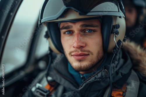 Young man in pilot helmet flying an aircraft photo