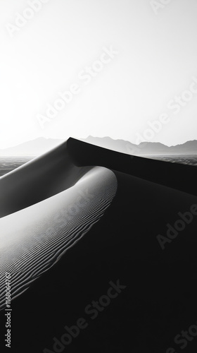 Ethereal black and white desert landscape showcasing smooth sand dunes, creating serene and minimalistic atmosphere. gentle curves and shadows evoke sense of tranquility