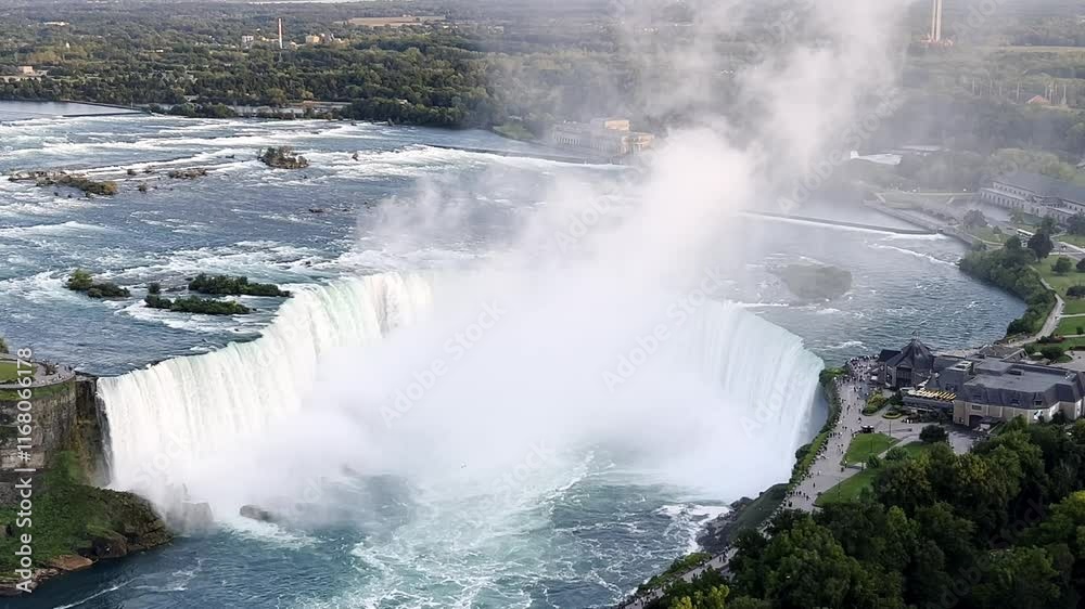 Breathtaking aerial view of Niagara Falls Horseshoe, showcasing cascading water, misty spray, and lush greenery in a stunning natural landscape, Canada, zoom in Breathtaking aerial view of Niagara Falls Horseshoe, showcasing cascading water, misty spray, and lush greenery in a stunning natural landscape, Canada, zoom in