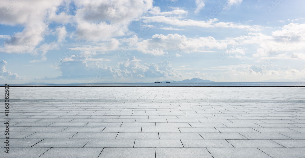 Empty square floor and coastline with sky clouds nature landscape in summer. Parking lot by the sea.