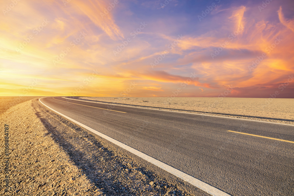 Fototapeta premium Asphalt highway road and desert with beautiful sky clouds natural landscape at sunset in Xinjiang, China. Outdoor road background.
