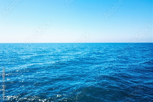 Wallpaper Mural Blue ocean waves reflecting sunlight under a bright clear sky. Scenic and tranquil seascape on a sunny day. Concept of serenity, nature. Ai generative Torontodigital.ca