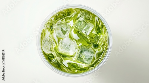 Overhead view of iced green tea in a plastic cup with ice cubes.