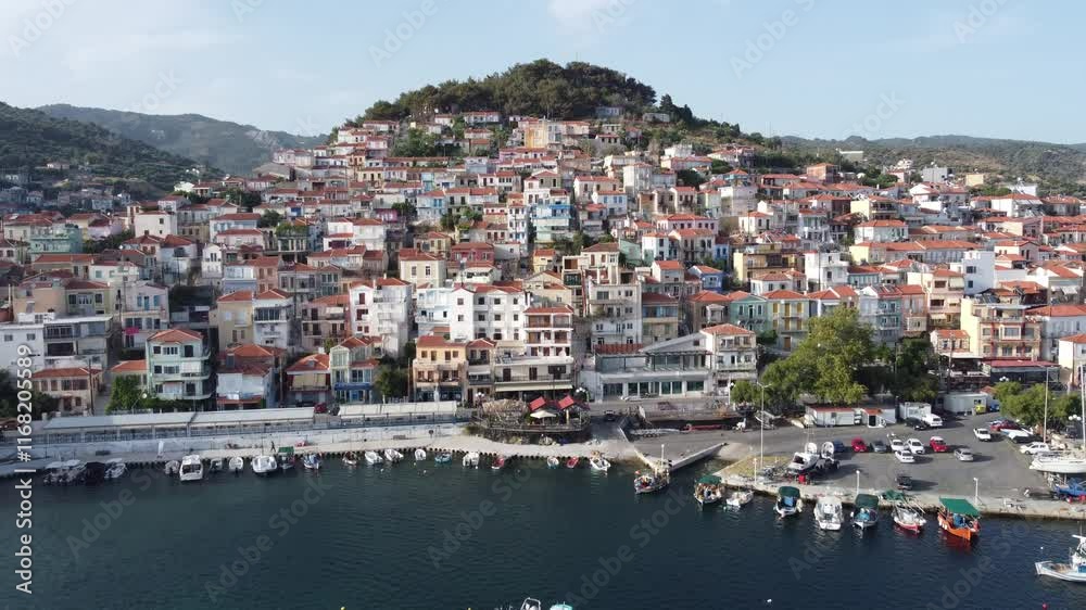 Establishing shot of Plomari town seaside traditional houses, Lesbos island, Aegean sea, Aerial tracking shot Establishing shot of Plomari town seaside traditional houses, Lesbos island, Aegean sea, Aerial tracking shot
