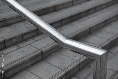 Close up image of stainless steel handrails are installed on the walls and steps.