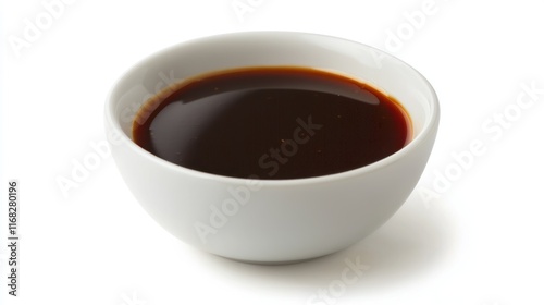 Dark sauce in a small white bowl