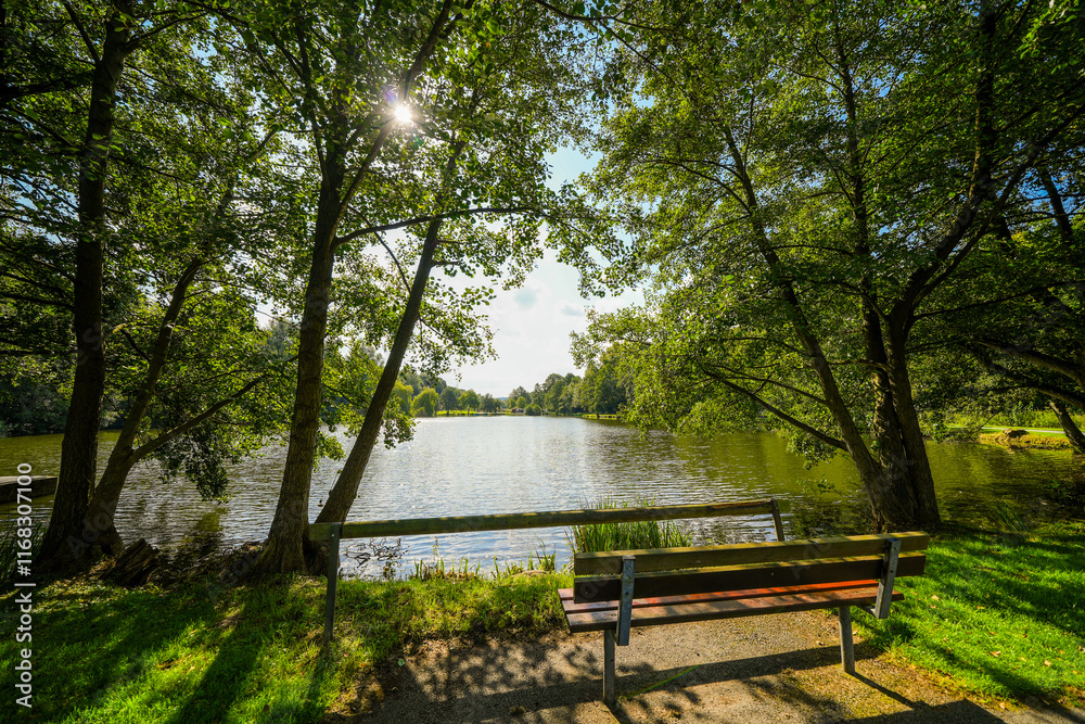 View of the paddling pond at the spa park in Bad Wünnenberg. Recreation area in the city.
View of the paddling pond at the spa park in Bad Wünnenberg. Recreation area in the city.
