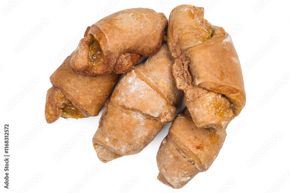 A bunch of fresh homemade croissants on a white background. Brown croissants with jam. A bunch of fresh homemade croissants on a white background. Brown croissants with jam.