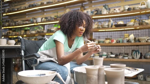 Young women is making earthenware at workshop. Small business and hand craft product.