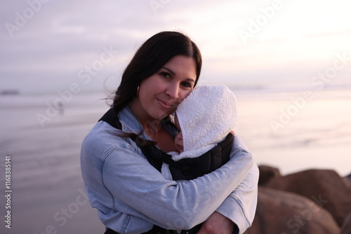 Beautiful Young Mom Holding Baby Girl Outdoors
