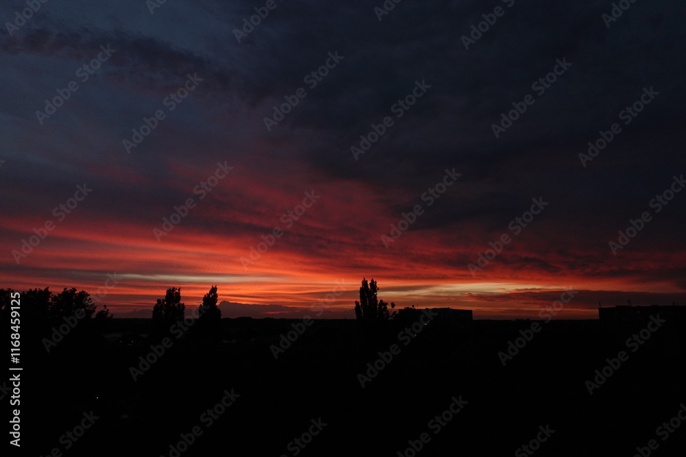 Fototapeta premium Orange sunset and clouds