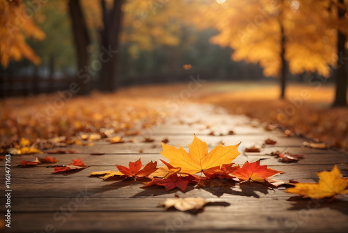 Falling maple leaf's on the empty wooden table top in autumn
