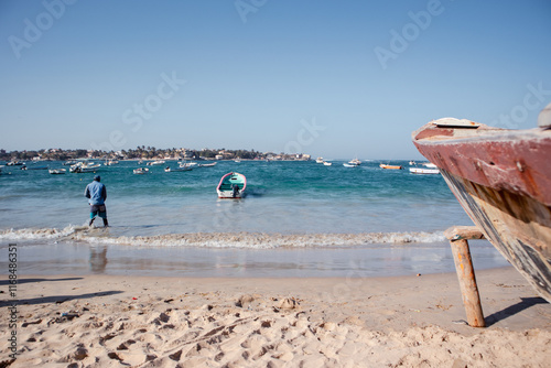 Obraz na płótnie Typical fishing boats in Yoff Dakar, Senegal, called pirogue or piragua or piraga. Colorful boats used by fishermen standing on the beach.. w salonie
