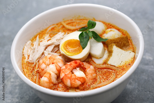 Laksa lemak is a noodle dish from Malaysia and Singapore.
A creamy spicy soup made with a coconut milk base. Common ingredients include shrimp, tofu, boiled eggs, and laksa leaf. 