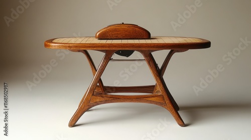 Mid-century modern wooden coffee table with unique design and inlaid top.
