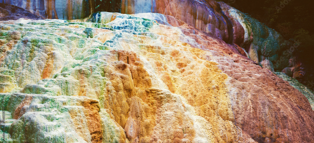 Colorful rock. Thermal springs San Filippo in Tuscany Italy. Nature background. Horizontal banner