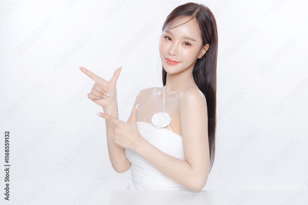 Young Asian woman long hair with clean fresh skin Korean makeup pointing to copy space on white background, Female model Face care, Facial treatment, Cosmetology, beauty and spa, Asian women portrait. Young Asian woman long hair with clean fresh skin Korean makeup pointing to copy space on white background, Female model Face care, Facial treatment, Cosmetology, beauty and spa, Asian women portrait.