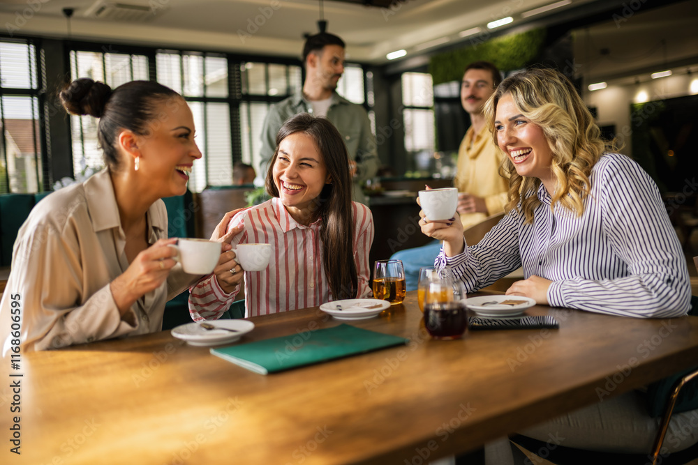 Group of female friends drinking coffee at the restaurant while the guys in the back try to flirt and send them drinks. Group of female friends drinking coffee at the restaurant while the guys in the back try to flirt and send them drinks.