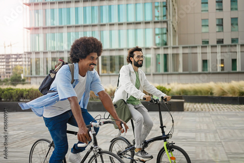 Happy casual business friends going to work with bicycle in the city 