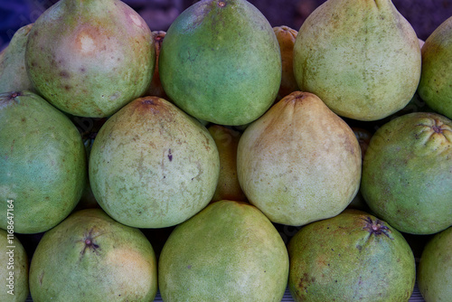 Green pomelo citrus fruit in market