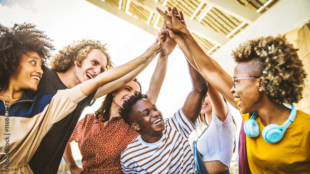 Obraz premium Community of young people stacking hands together - Multiracial college students putting their hands on top of each other - Human relationship, social, community and college concept