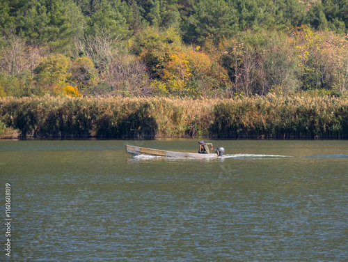 Fisherman at Pamvotida Lake in Ioannina, Greece photo