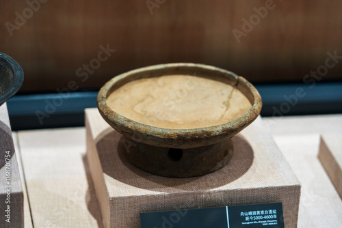 Ancient Pottery Bowl Displayed in Museum Exhibit photo