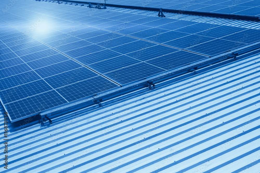 Solar panel against sunny sky, photovoltaic saving energy technology blue color tone. Solar panel against sunny sky, photovoltaic saving energy technology blue color tone.