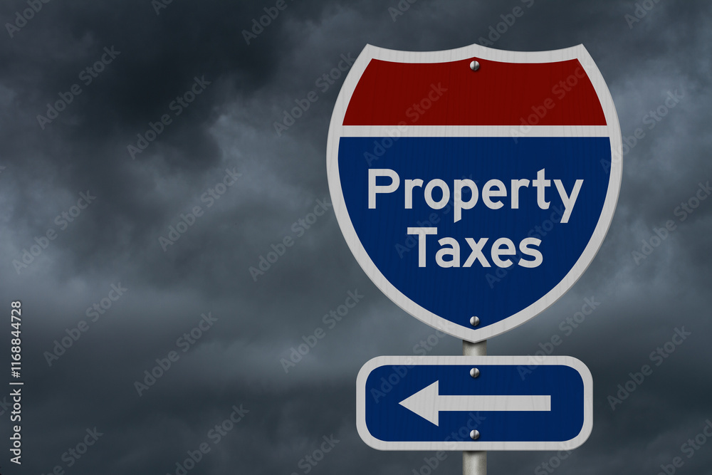 Property taxes road sign with arrow under stormy cloud Property taxes road sign with arrow under stormy cloud