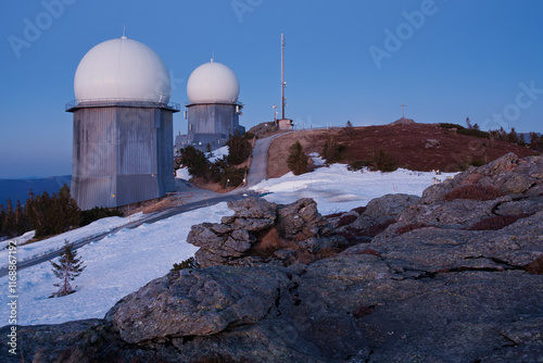 
military radar and civilian metrological stations on top of Velké Javor mountain with remnants of spring snow (Šumava Mountains) photo