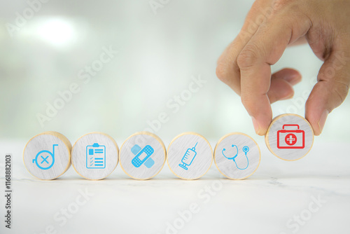 Hand chooses wooden toy stack with wellness medical care and healthy for family safety insurance plan or personnel sickness illness treatment concept.
