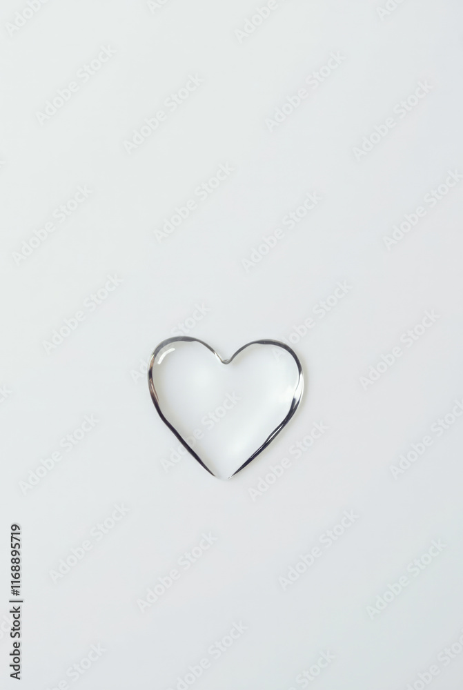 A Single Water Droplet Shaped Like a Heart, Glossy and Reflective, Set Against a Clean White Background A Single Water Droplet Shaped Like a Heart, Glossy and Reflective, Set Against a Clean White Background