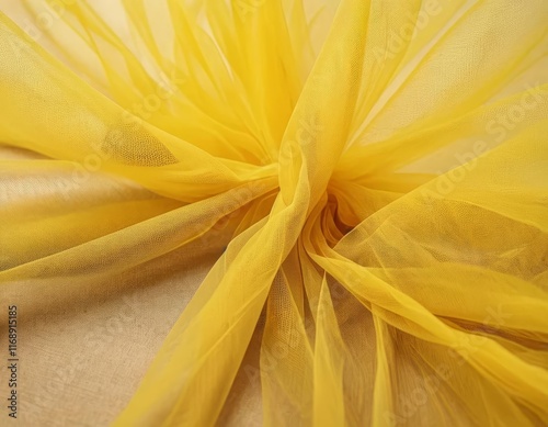 A close-up of a piece of yellow tulle fabric