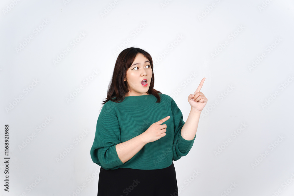 Showing Product and Pointing Side at copy space Of Beautiful Asian Woman wearing green Isolated On White Background Showing Product and Pointing Side at copy space Of Beautiful Asian Woman wearing green Isolated On White Background